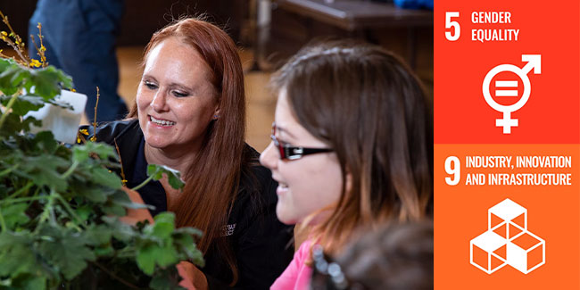 Woman working with a plant