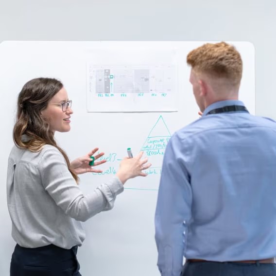 Woman explaining white board