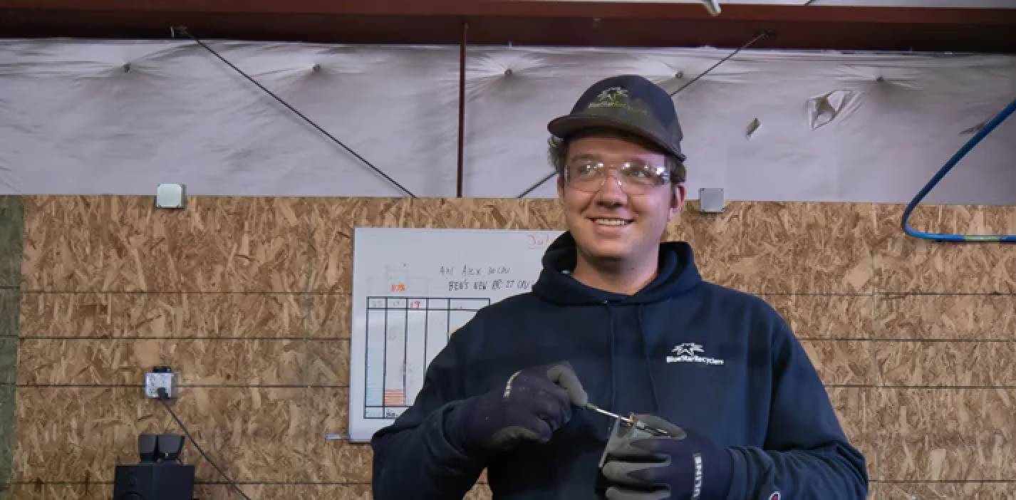 Man recycling electronics